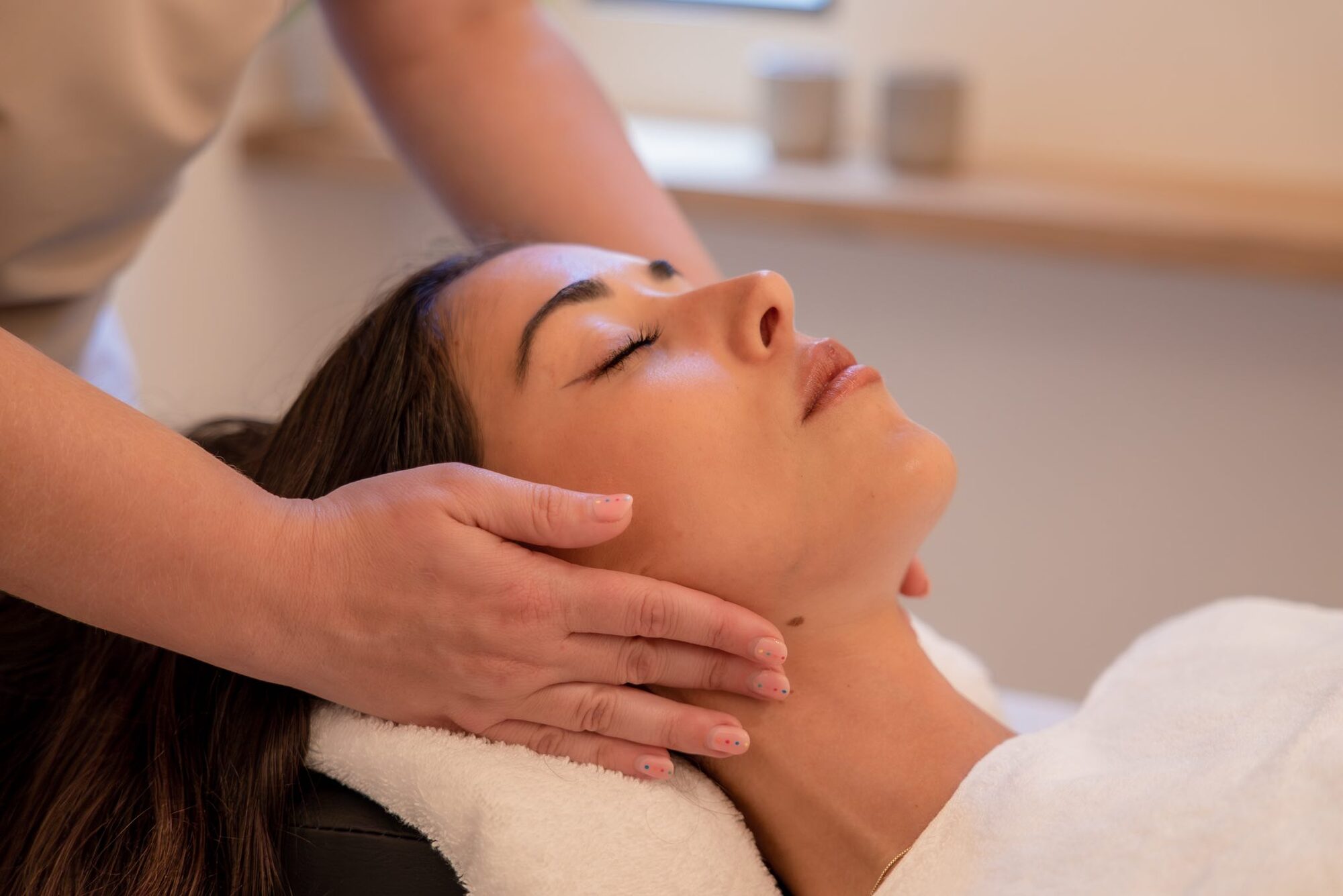A massage and treatment room at NEMA, calm and pared-back