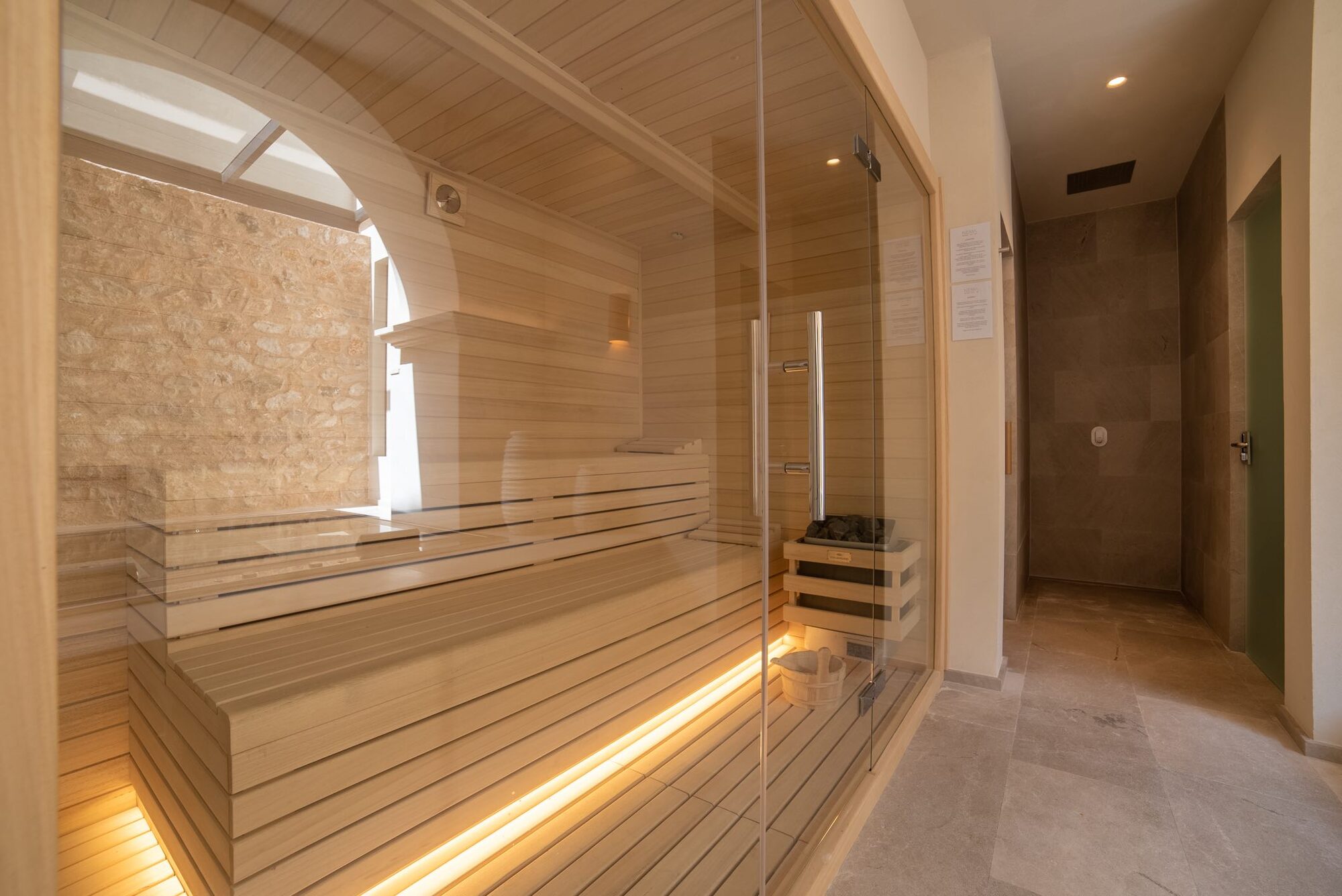 The cedar-lined sauna at NEMA, warm and softly lit